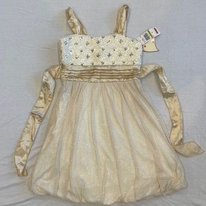 Kids formal gold and cream sparkly dress. Brand is Speechless and ties in back